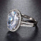 Feshionn IOBI Rings "Ingenue" 6 Carat Oval Halo White Gold Plated Split Shank Ring